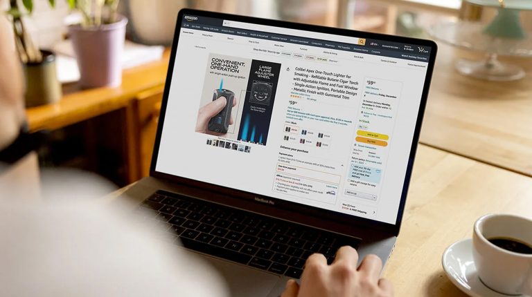amazon agency | man typing on his laptop with dashboard