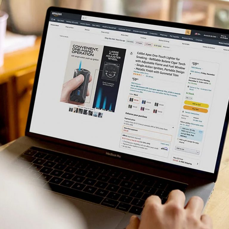 amazon agency | man typing on his laptop with dashboard